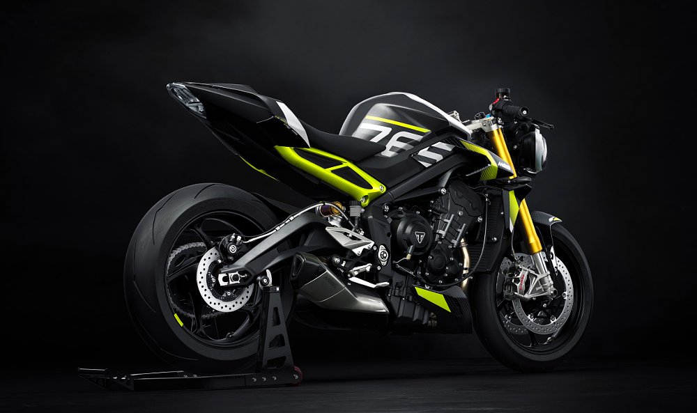 rear view of the white and neon yellow Moto2 parked at the track