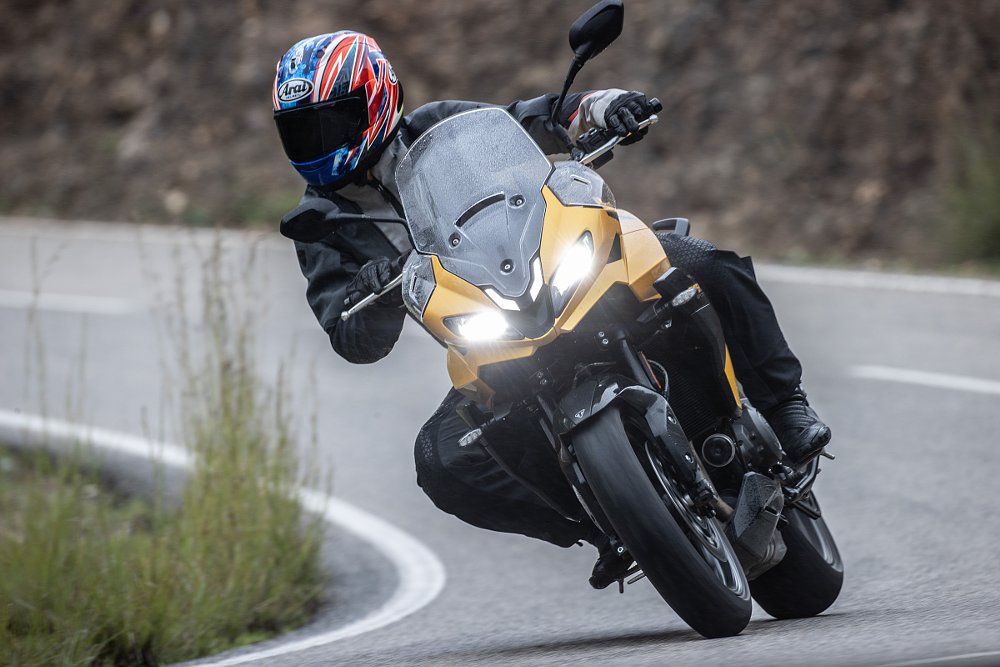 Dustin riding the yellow Triumph Tiger Sport 800 in Spain