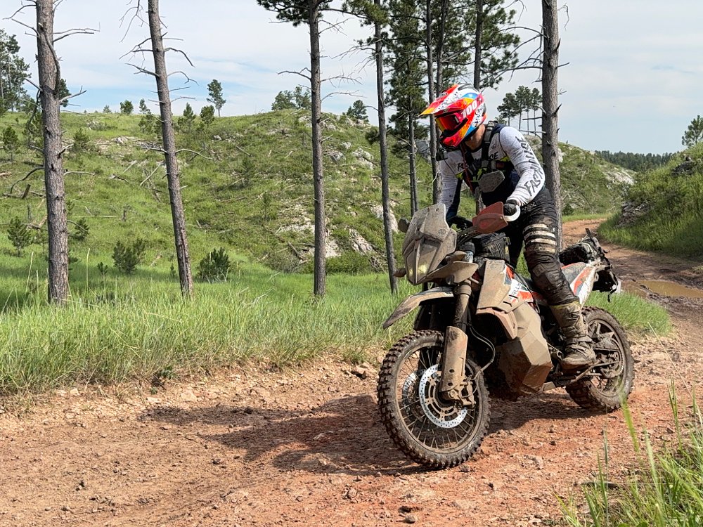 Spurgeon riding his KTM on a trail in the Black Hills of South Dakota