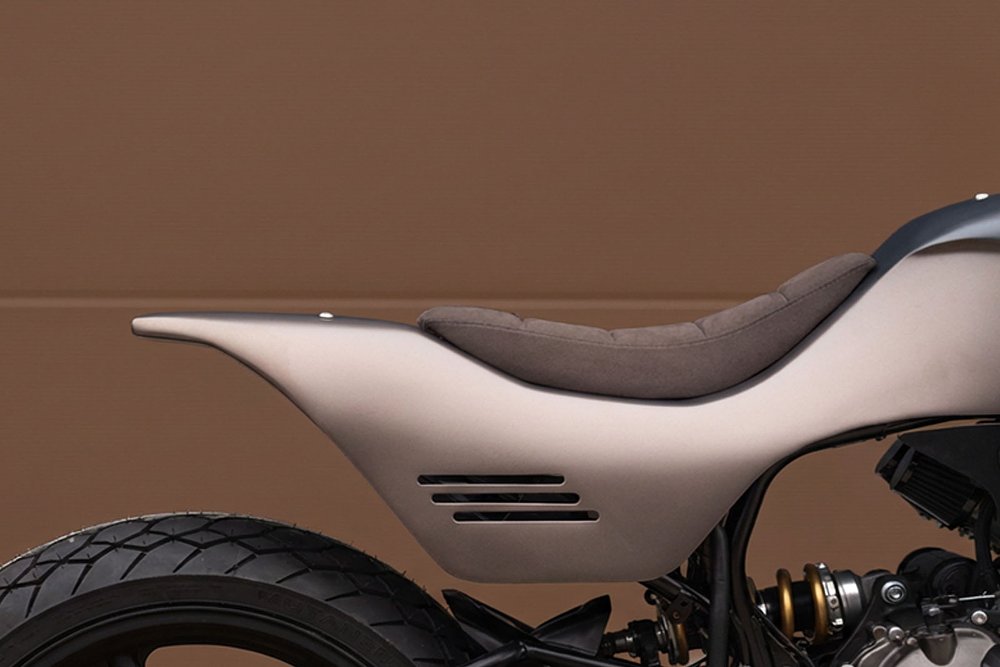 close view of the brown seat and muted colors on the bodywork