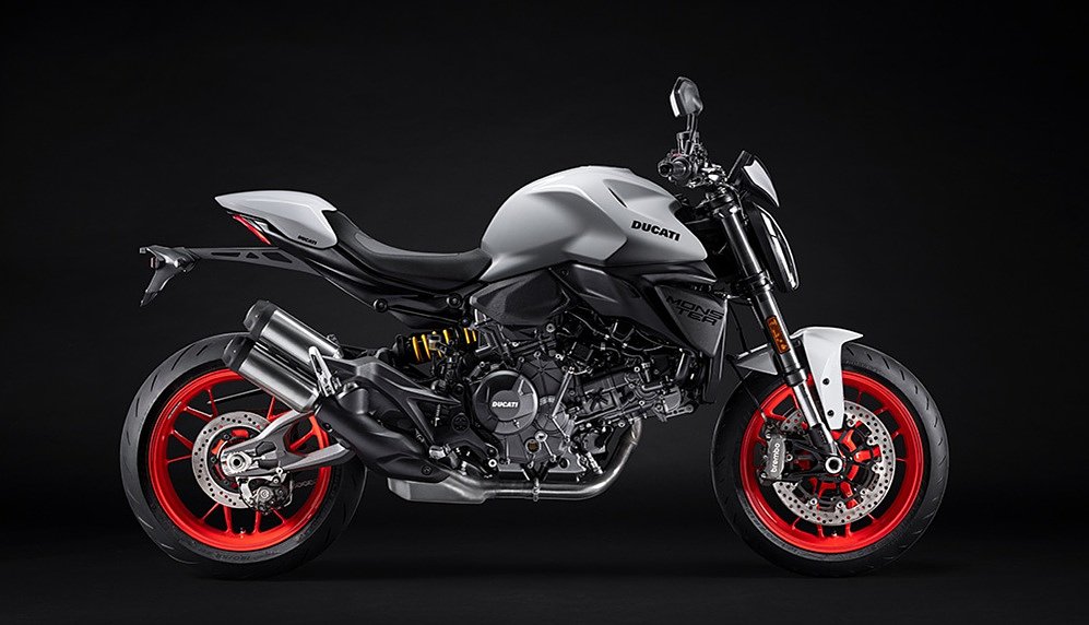 studio photo of the Ducati Monster in white with red wheels