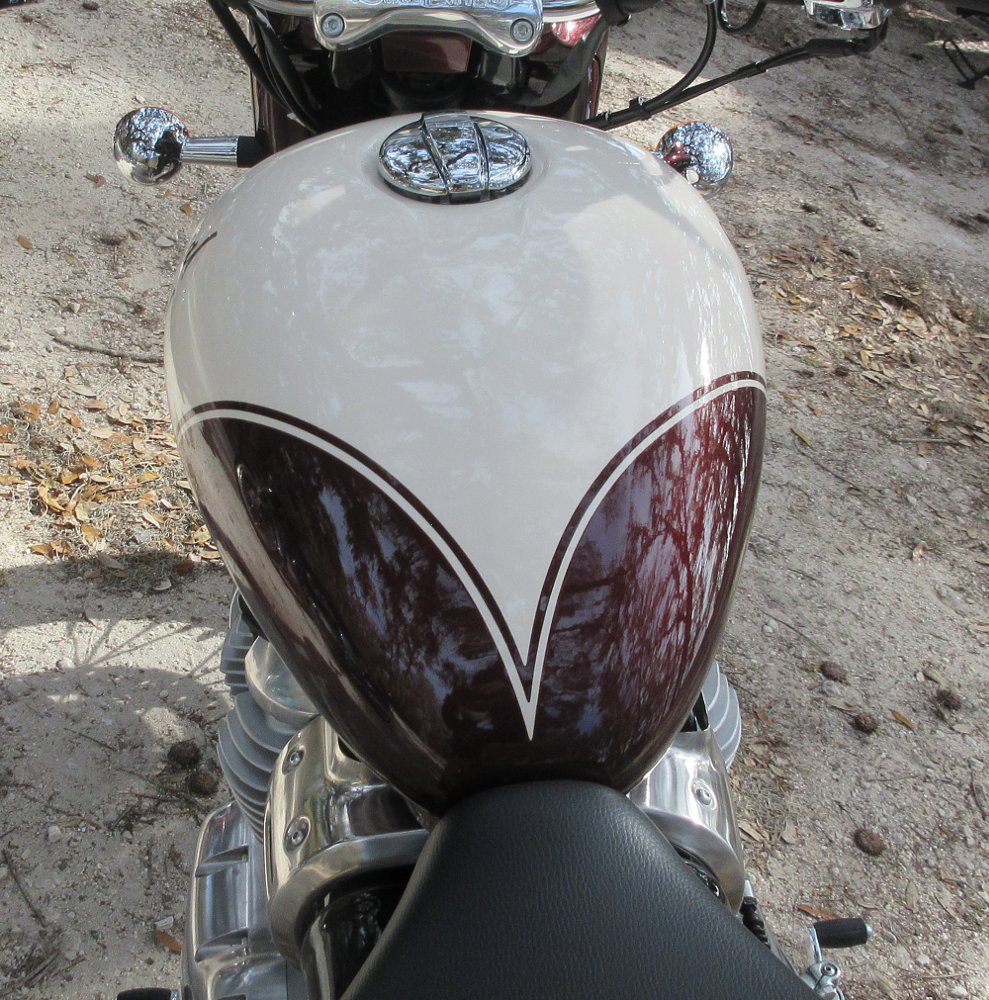 view from above of the red and white fuel tank with v-shaped paint design