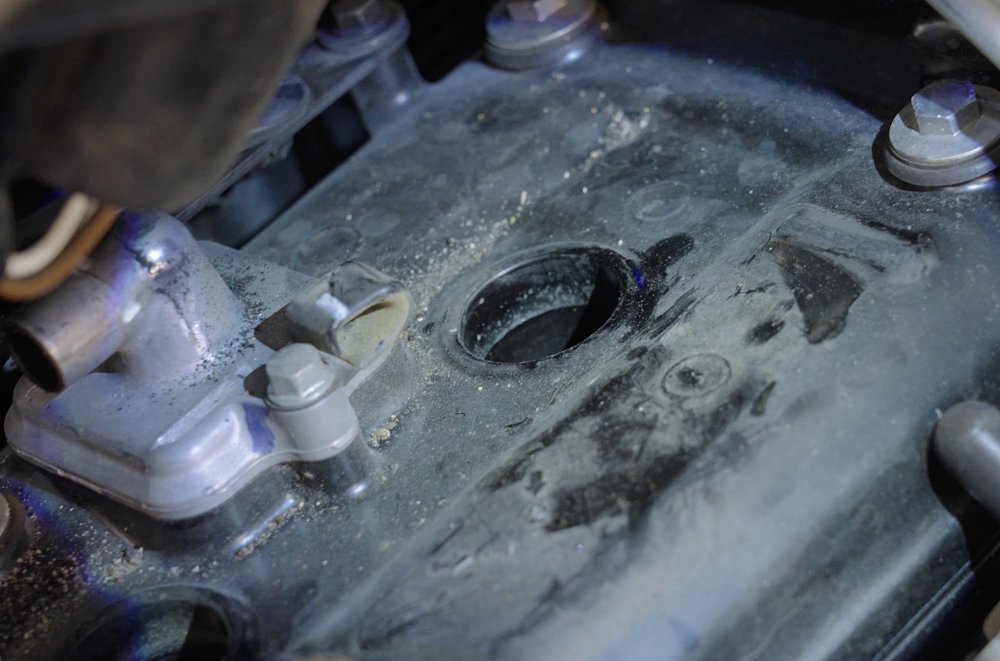 Debris on a motorcycle valve cover 