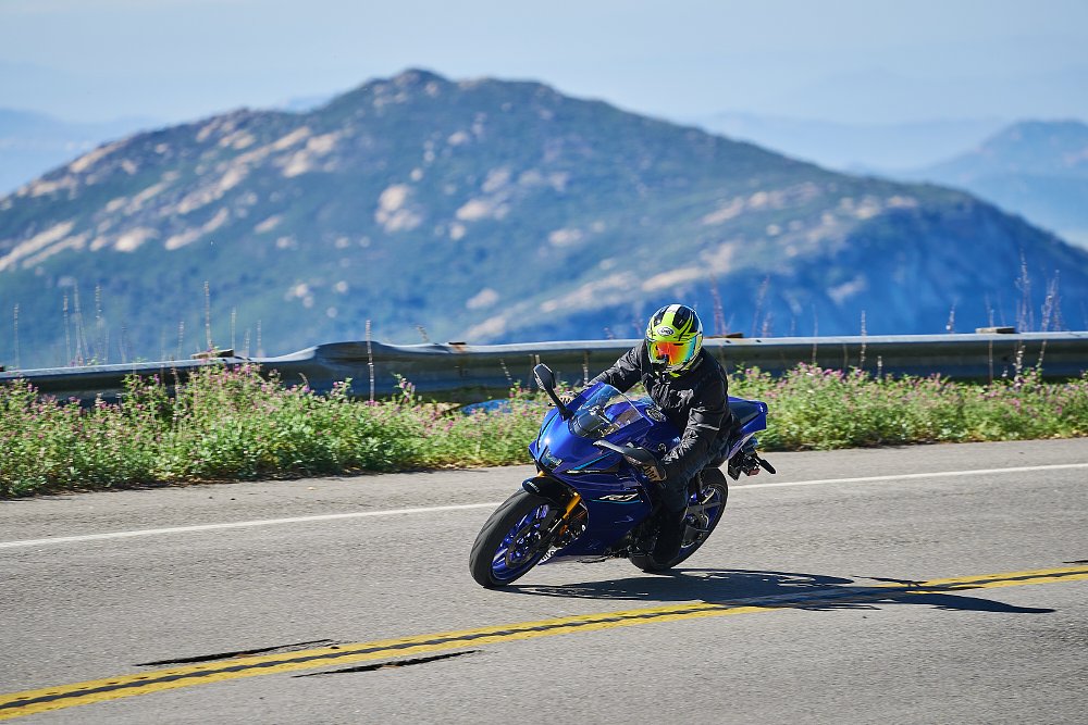 rider on the blue R7 on a curvy road