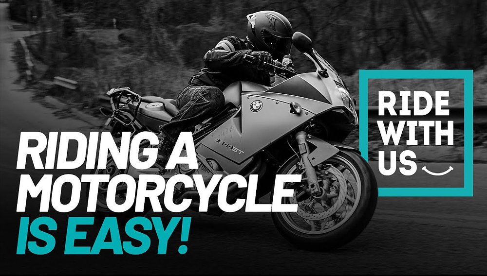 An experienced motorcyclists rides a BMW F 800 ST through a mountain pass.