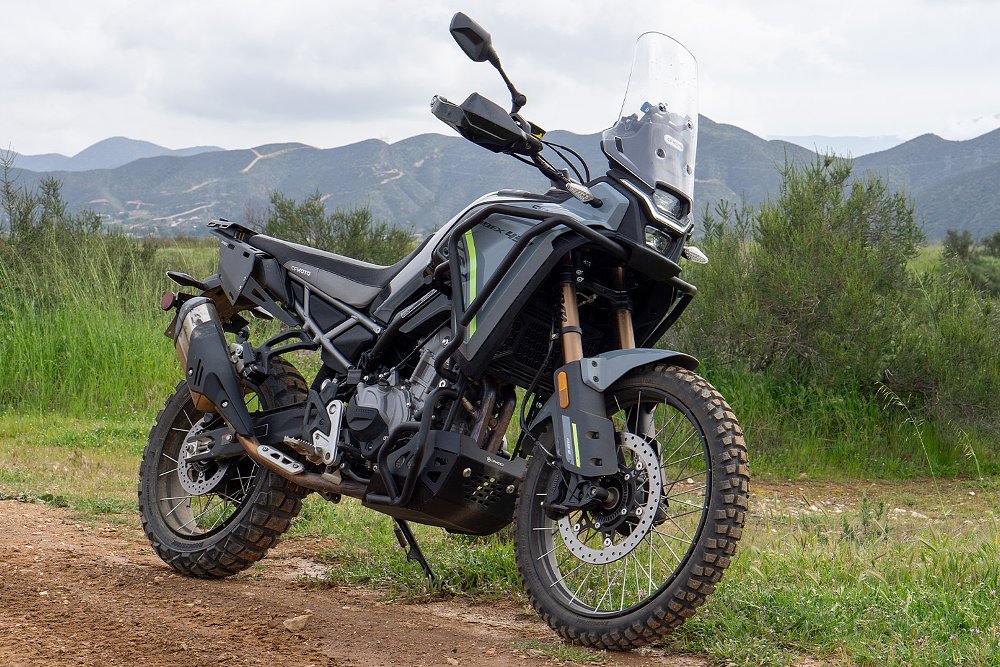 An accessorized CFMOTO Ibex 450 staged on a trail.