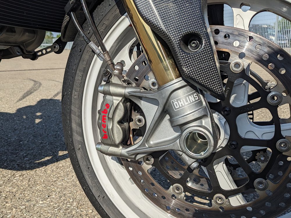 close view of the front wheel, brakes, and suspension