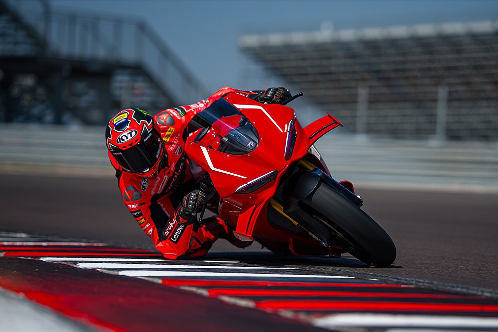 Nicolò Bulega pushes the Panigale V4R through a turn on the track.