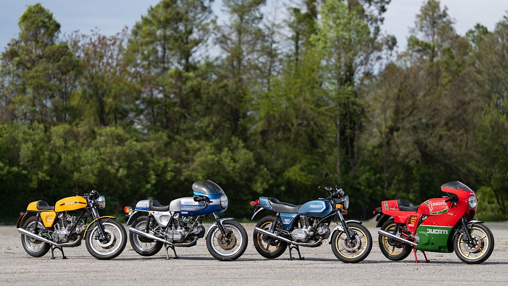 Billy Joel's four Ducati motorcycles staged on a tree-lined lot.