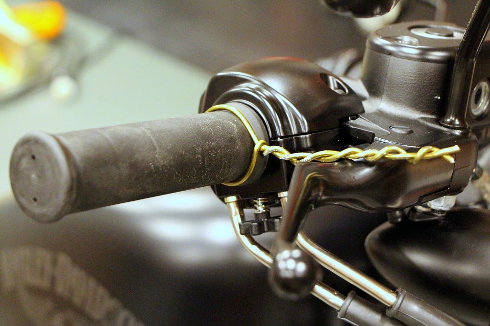 Coat hanger on a throttle