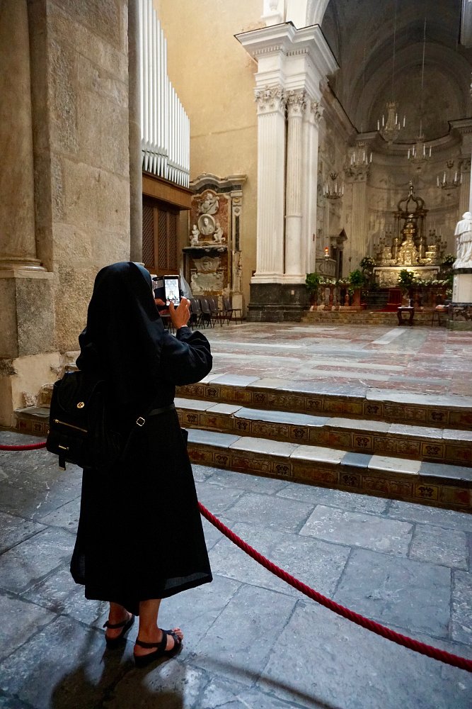 nun takes a photo