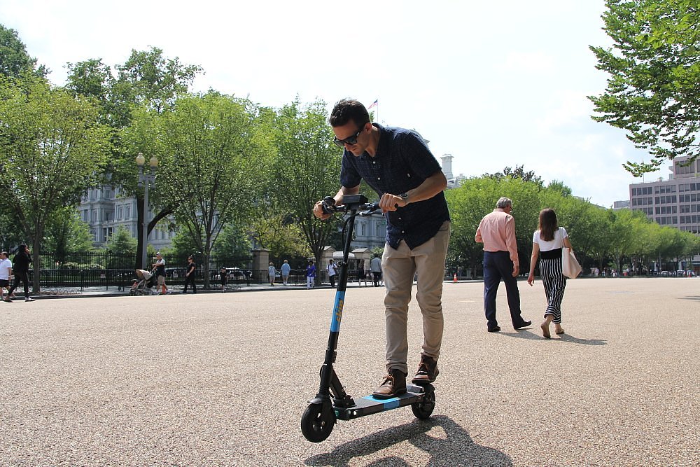 riding an e-scooter