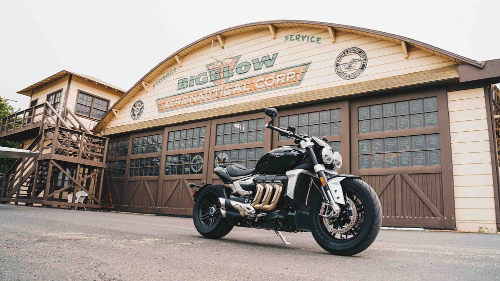 Triumph Rocket 3 in front of airport hangar