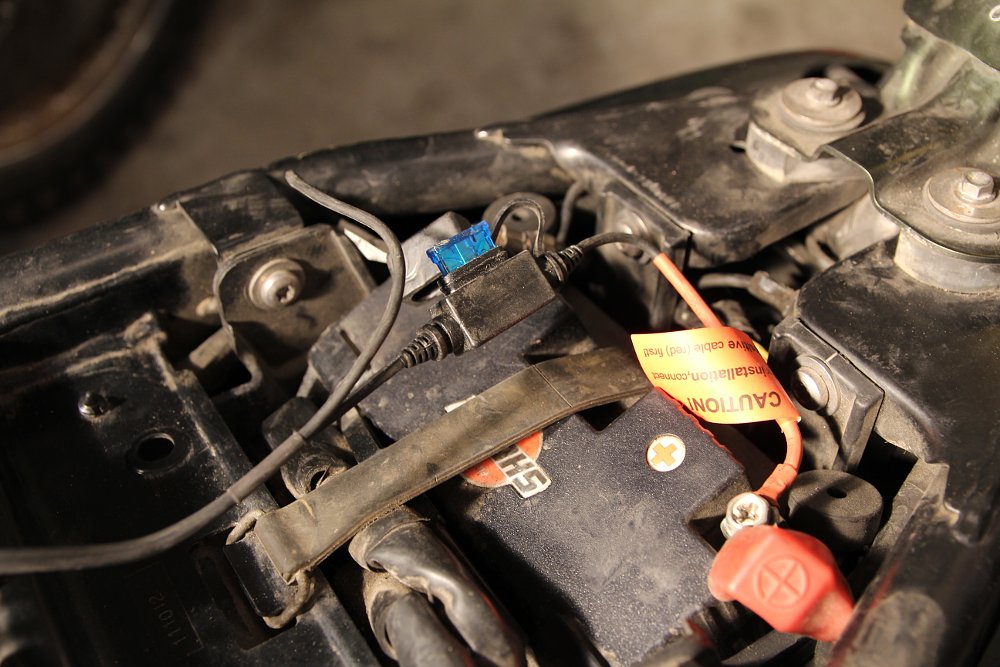 The heated battery harness is easy to install and provides continuous power to your heated gear. 