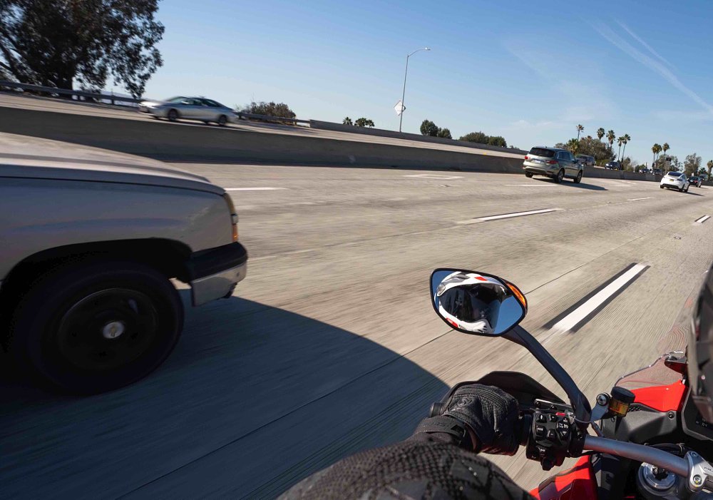 Ducati Multistrada V4 on board showing blind-spot warning lights above mirror