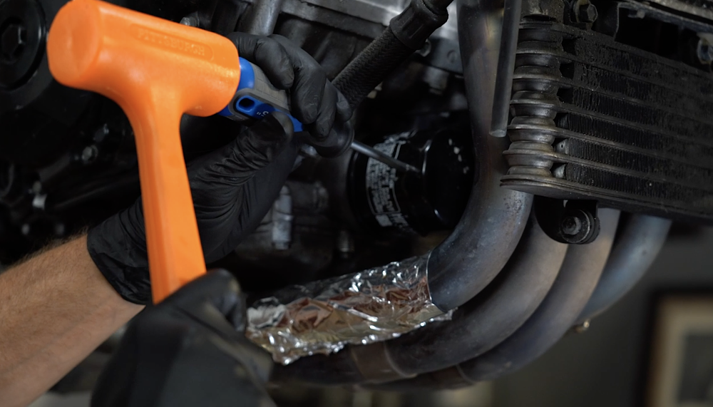 Removing a stuck oil filter. 