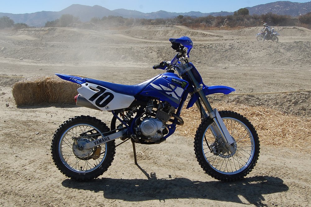 Yamaha TT-R 125 sitting at the side of the MX track.