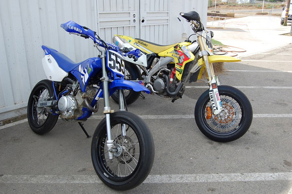 A Yamaha TT-R 125 and Suzuki RMZ 450 in supermoto trimmings