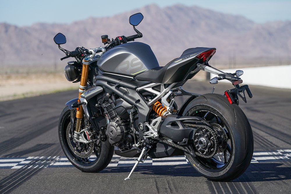 A rear quarter view of the Triumph Speed Triple 1200 RS motorcycle.