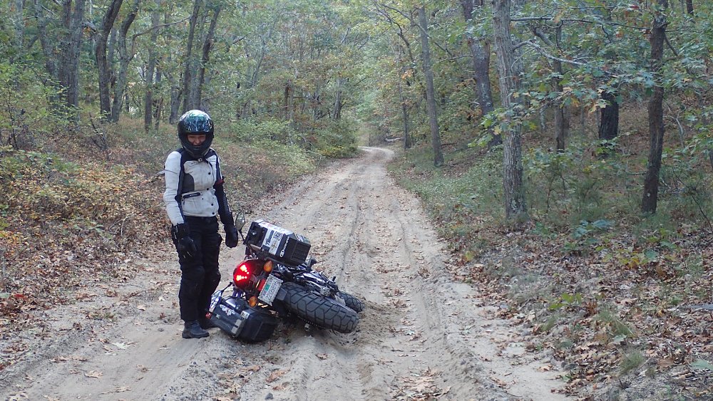 motorcycle fallen over on a muddy road