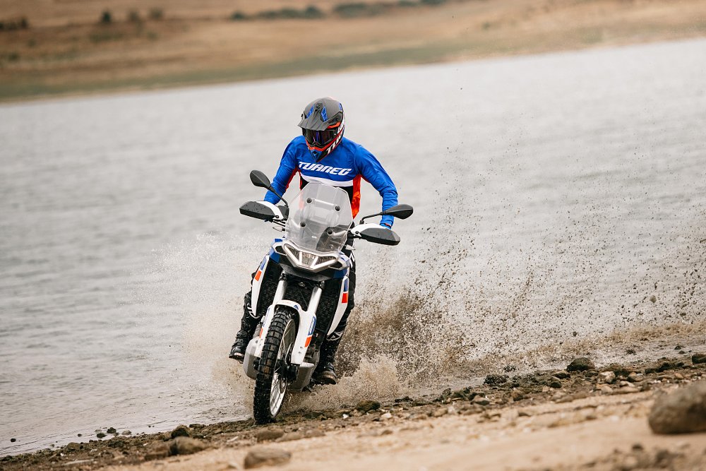 riding in the water's edge at the beach