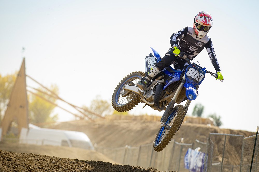 over a jump on the YZ125