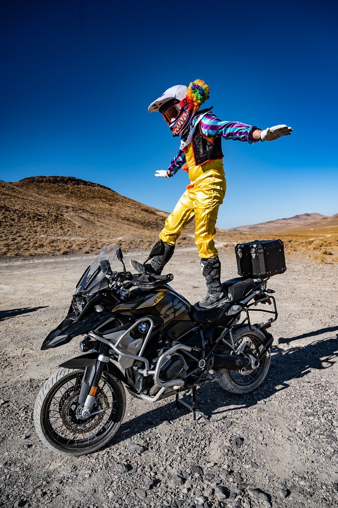 Kelly standing on his motorcycle in a Halloween costume
