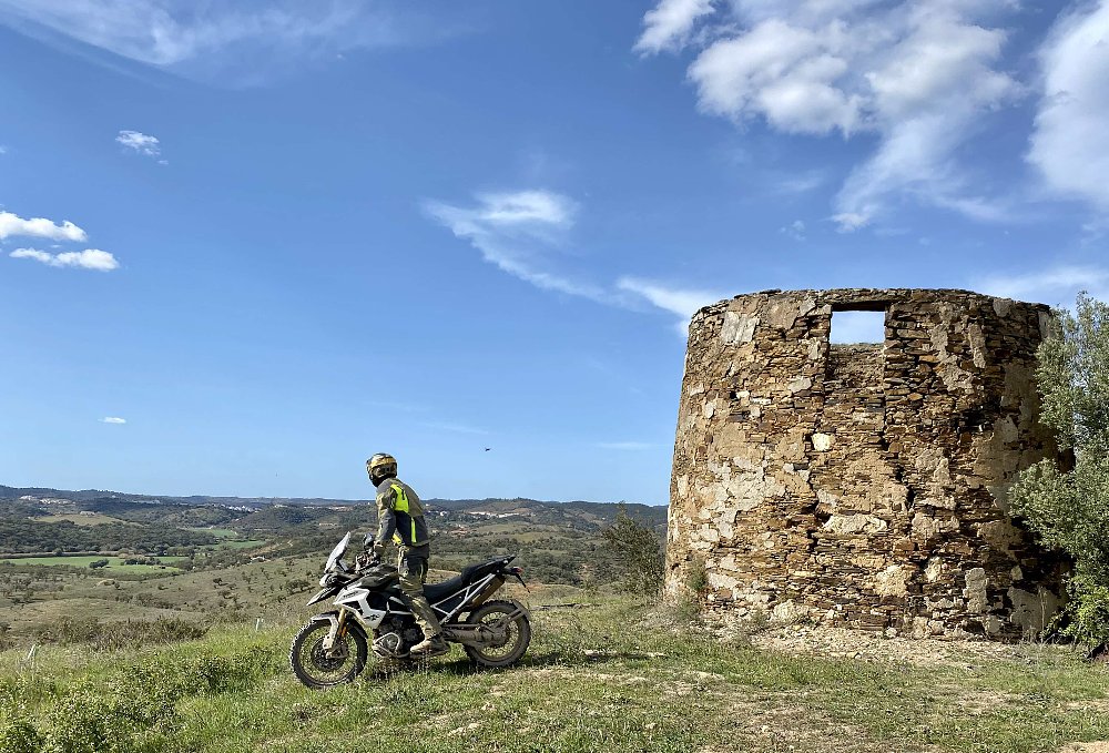 Triumph Tiger 1200 Rally Pro overlooking green pastures