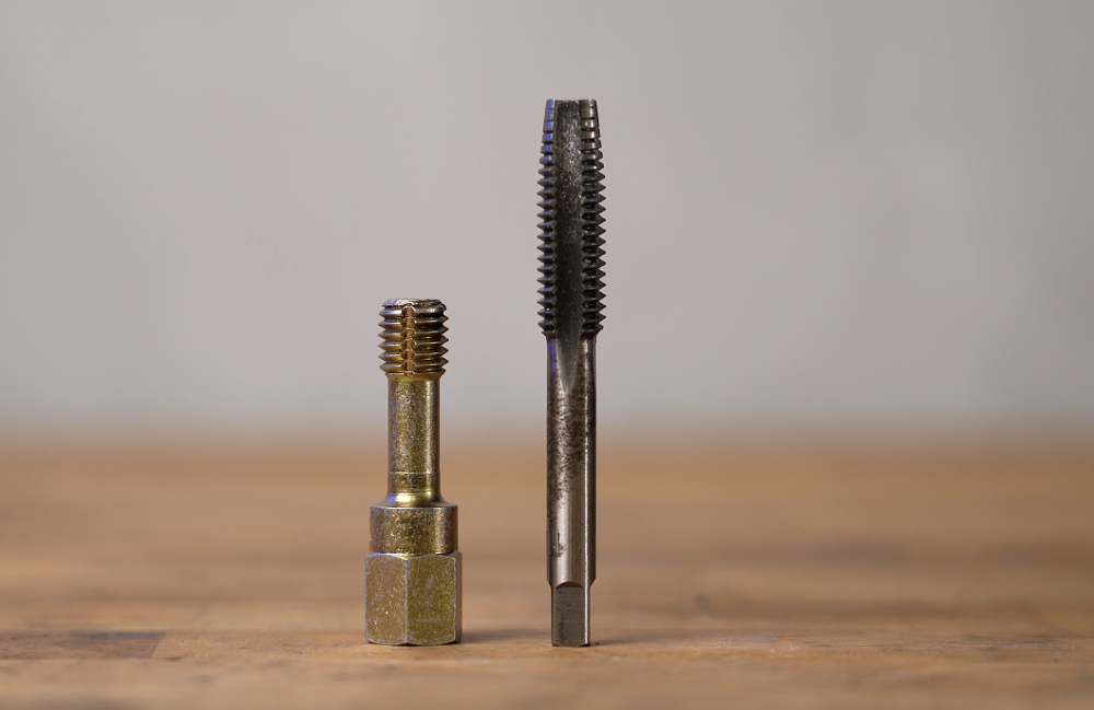 Thread chaser vs tap for repairing damaged threads.