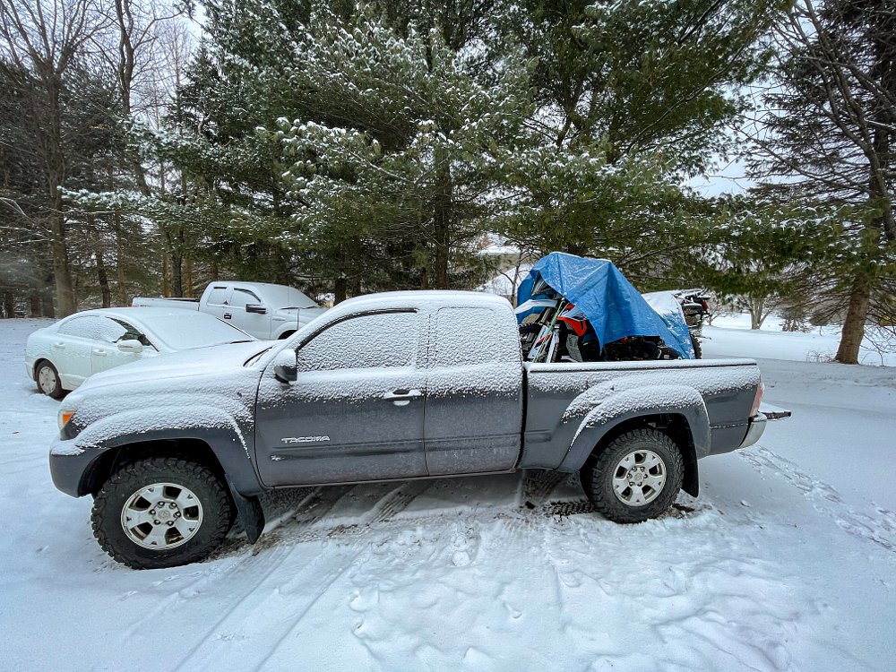 Toyota Tacoma hauling motorcycle 