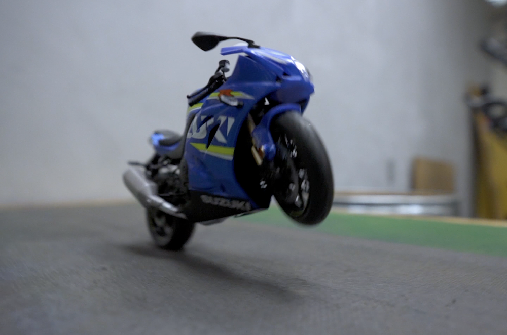Tablecloth trick with a model motorcycle. 