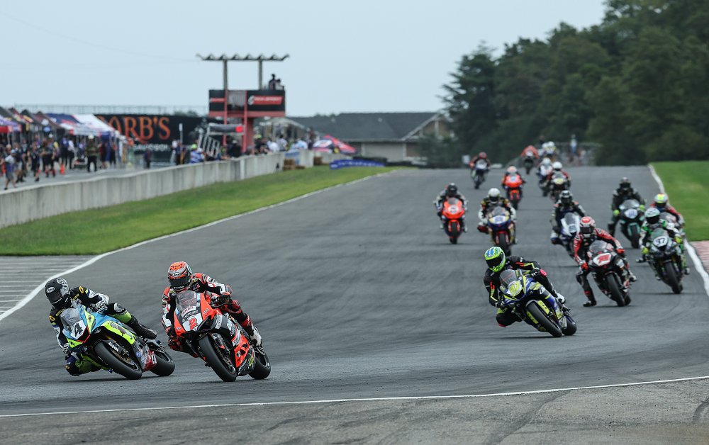 Josh Hayes passes Josh Herrin for the lead in the Supersport race