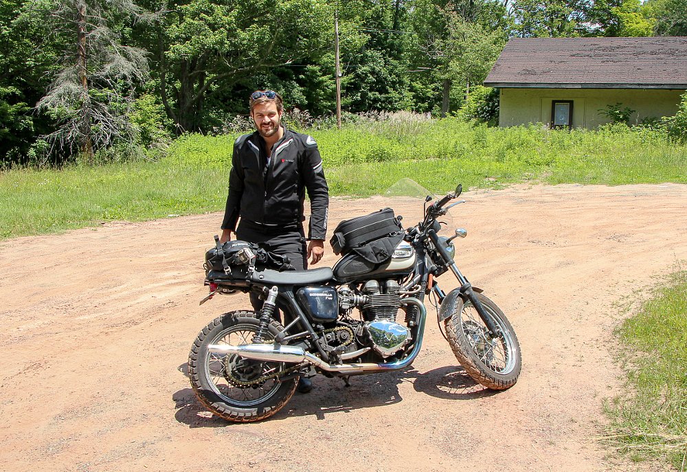 Spurgeon with his Triumph Bonneville fitted with knobby tires