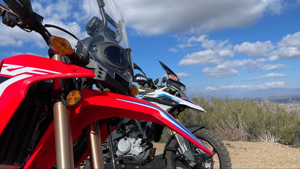 The Honda crf300l rally and bmw g 310 gs side by side on a hill
