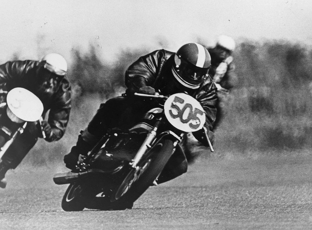 black and white photo of motorcycle race