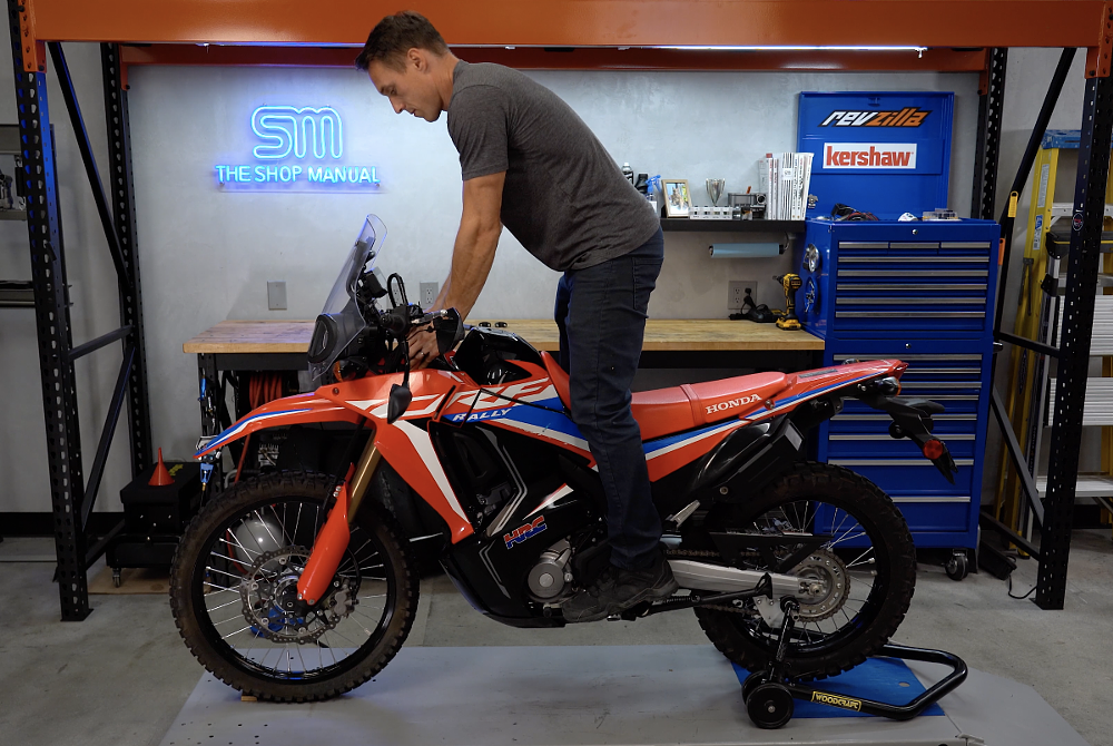 Compressing suspension to straighten the fork tubes. 