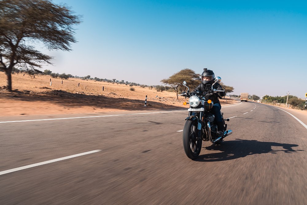 female rider Jen pilots the super meteor 650 on a desert road