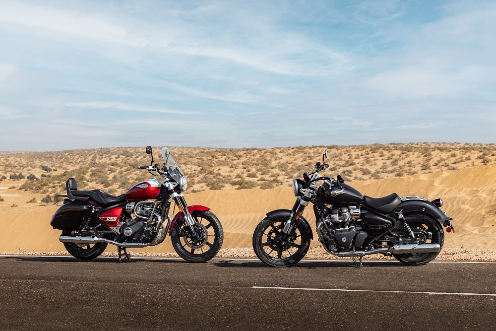 The red motorcycle has a grand tourer package displayed on it, and the green motorcycle has the solo tourer package on it