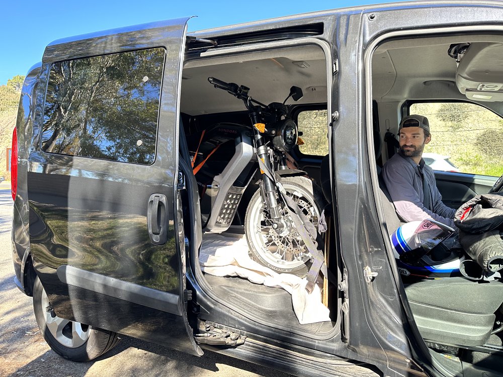 A Sondors MetaCycle loaded into a Dodge ProMaster City, shot with the side door open