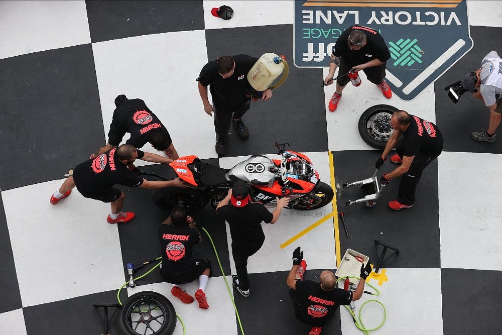 overhead view of a pit stop during a competition