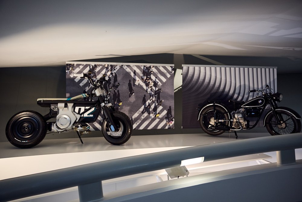 two motorcycles, old and new, built for urban commuting