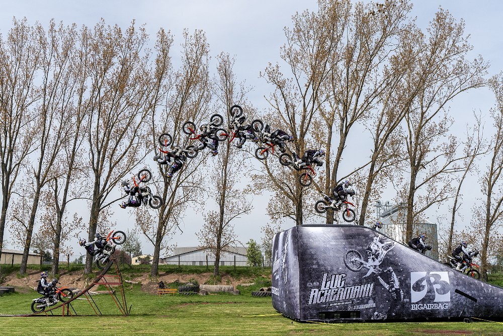 Luc and Melitta Ackermann complete the first-ever mother-son tandem motorbike backflip.