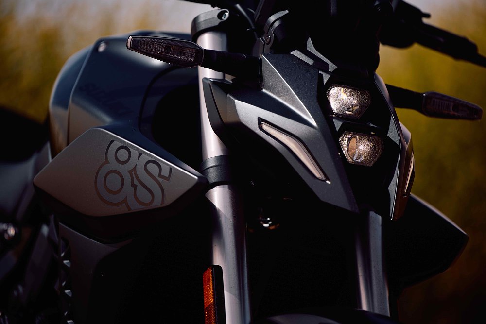 2023 Suzuki GSX-8S close up on the vertically stacked headlight and side cowl.