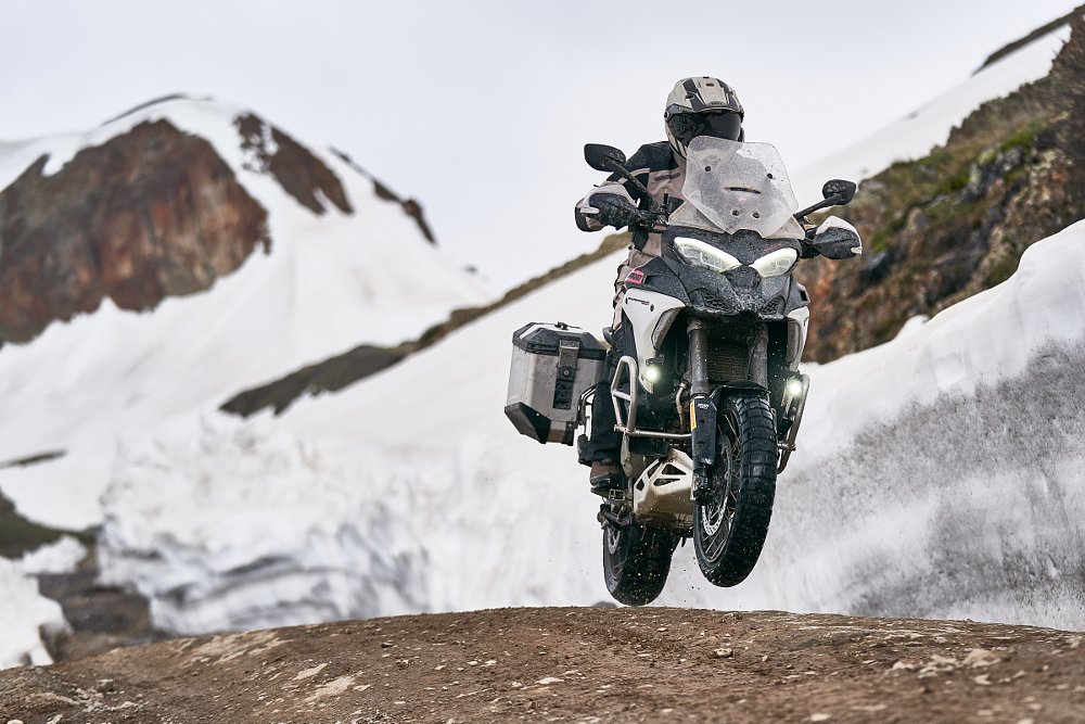 Multistrada V4 Rally doing a jump off-road