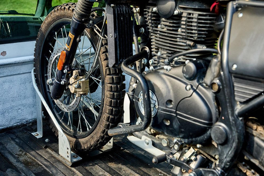motorcycle front wheel in wheel chock in truck bed