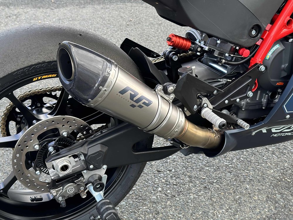2024 Kramer GP2-890RR rear wheel detail, showing the exhaust and swingarm.
