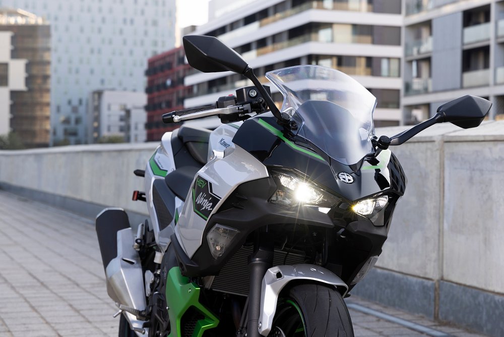 A close up view of the headlight and upper fairing of the Ninja 7 Hybrid.