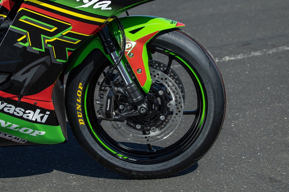 closeup of the front wheel and brakes