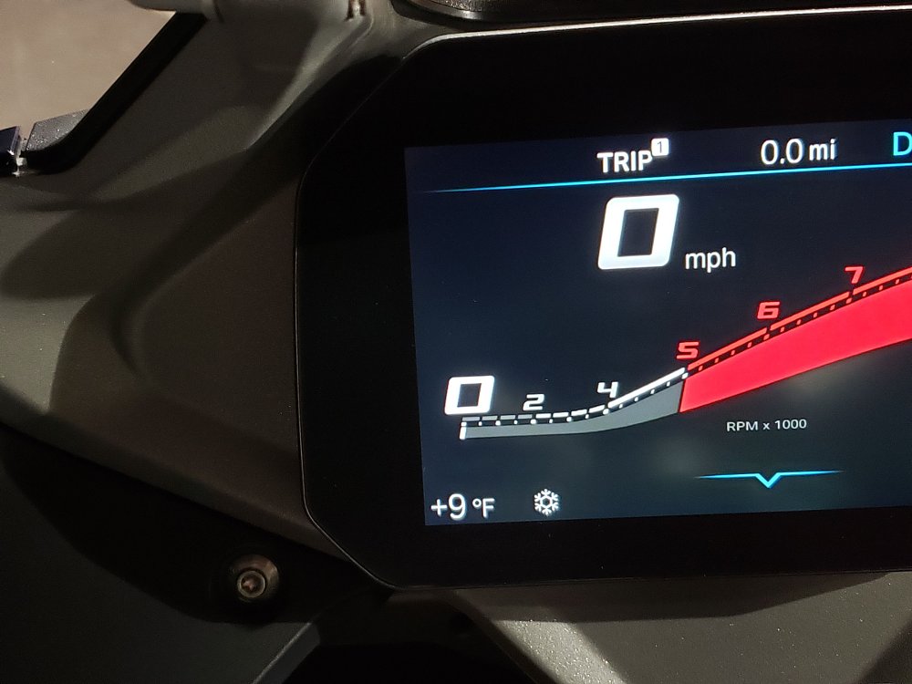 electronic display on a motorcycle showing nine degrees Fahrenheit