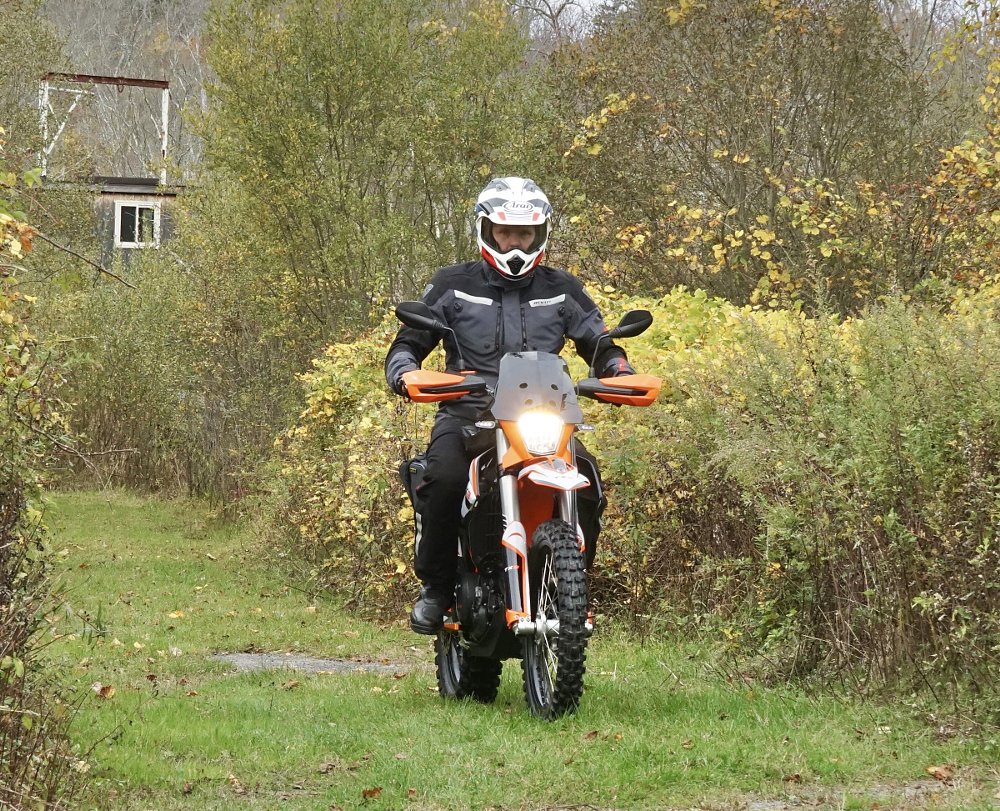 riding Tx3 on a grass path